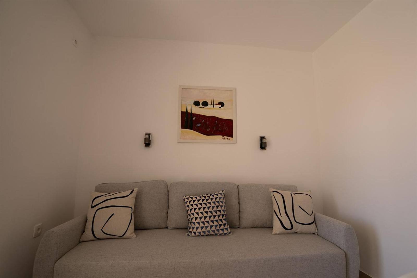 Apartments & Rooms Petra: sofa in a living area