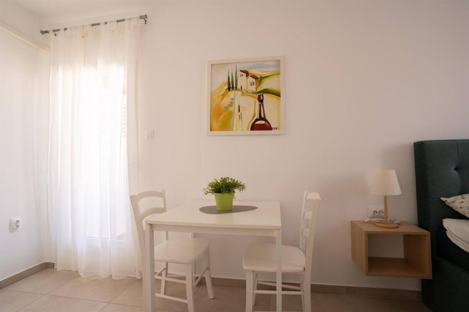 Apartments & Rooms Petra: small dining table by the window